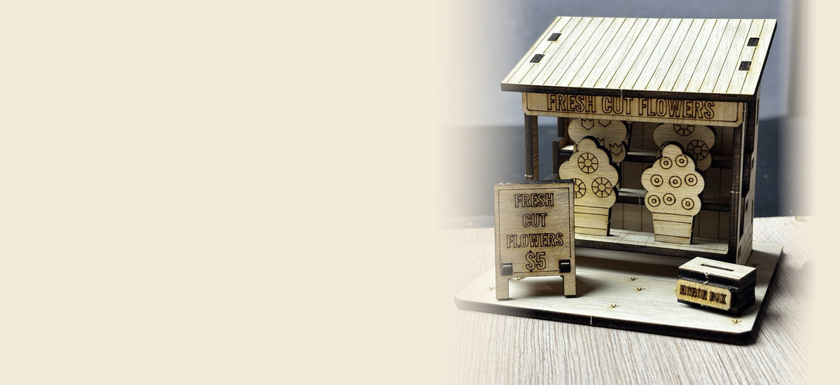 Laser-cut plywood Fresh Cut Flower Stand miniature with a sidewalk sign and honor box